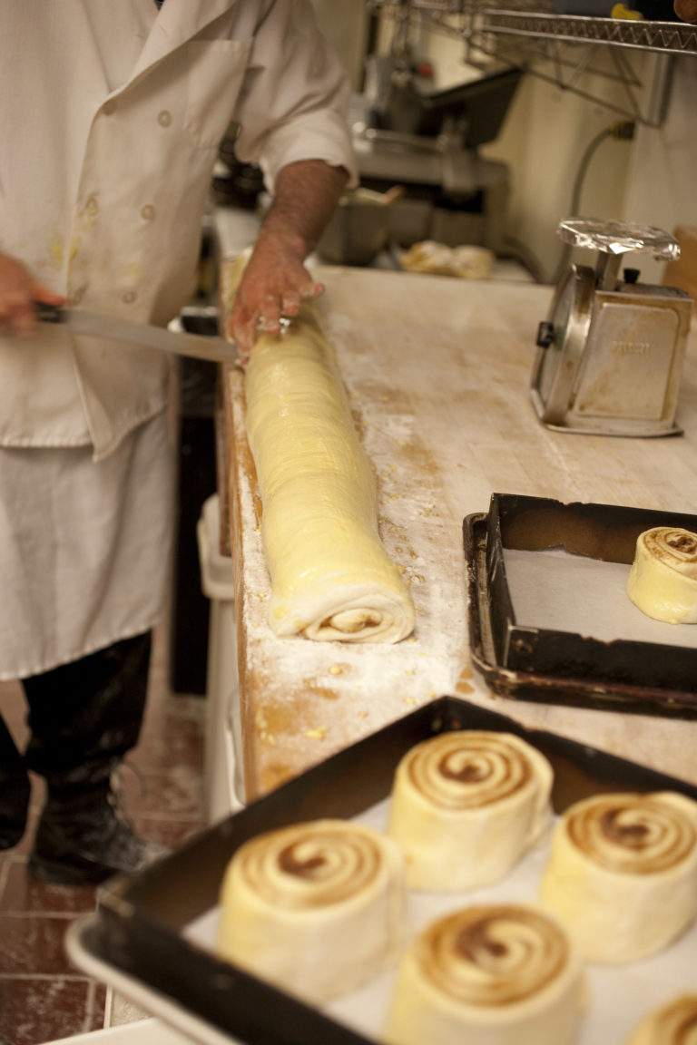 Rolling the cinnamon rolls